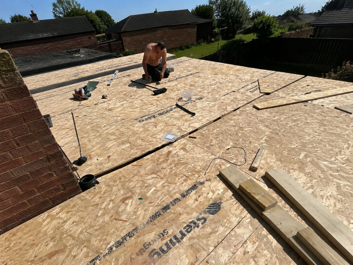Timber decking boards fixed down across a new frame
