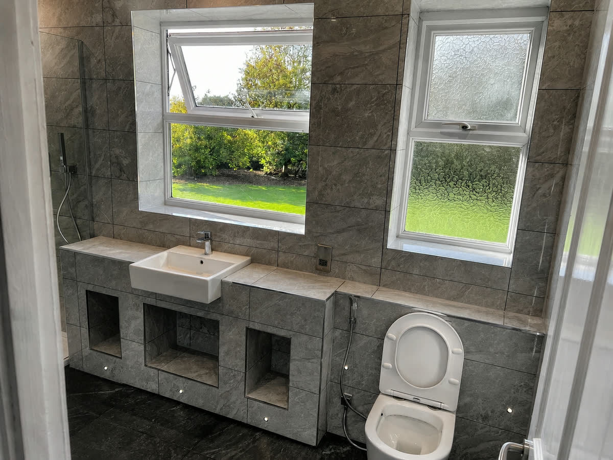 Completed bathroom with a fitted vanity unit