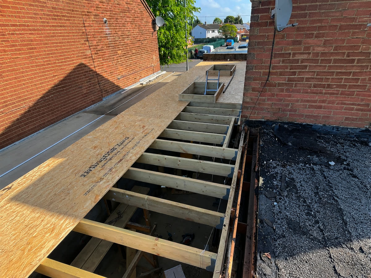 New roof joists installed over an extension