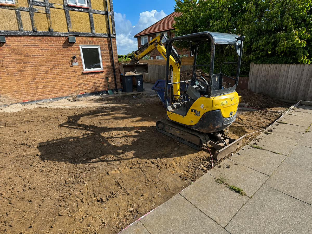 Groundwork being dug out with an excavator ahead of paving